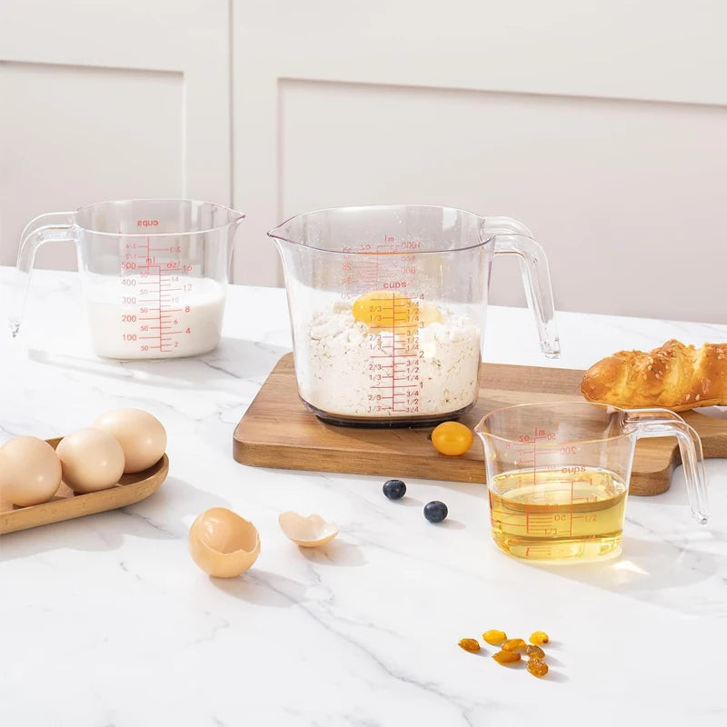 Set de 4 verres doseurs transparents avec poignée