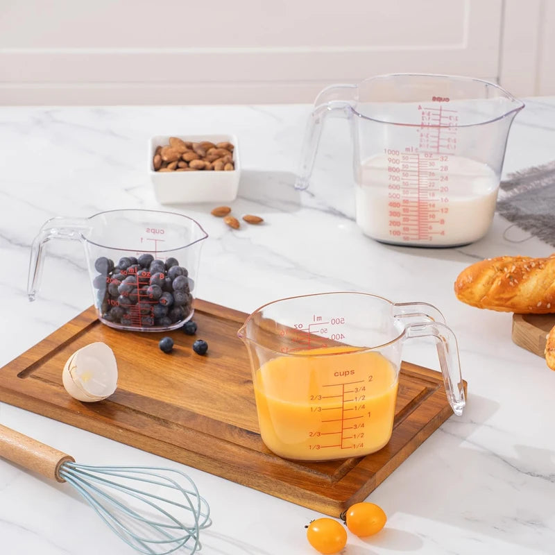 Set de 4 verres doseurs transparents avec poignée